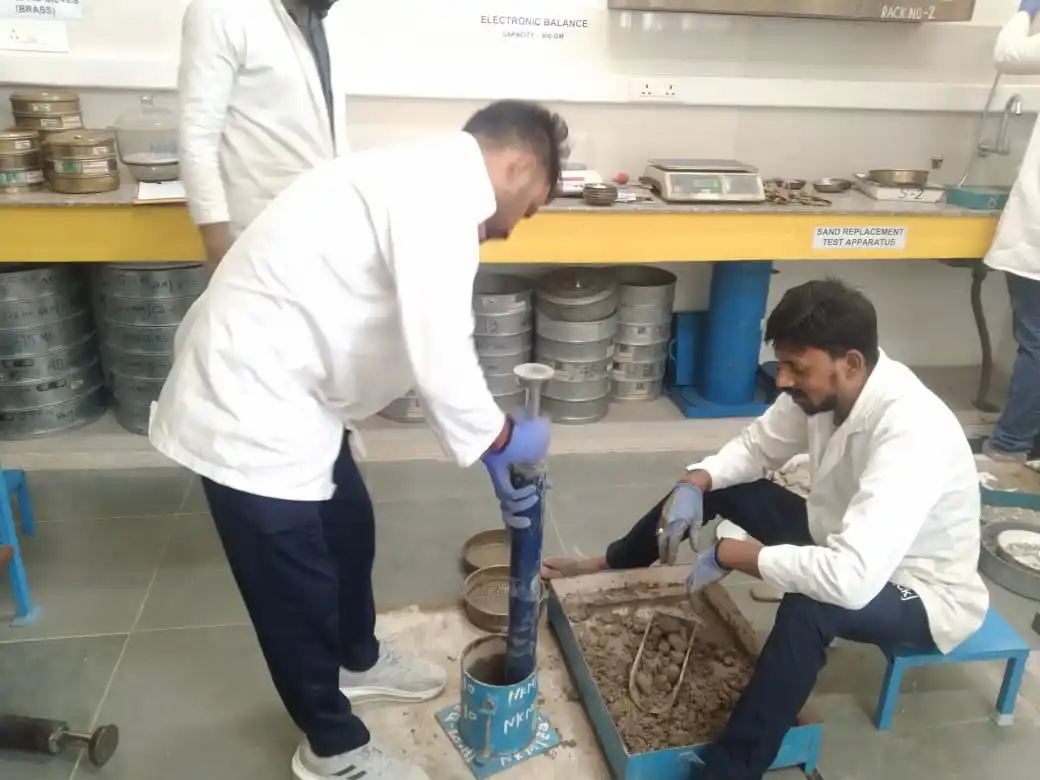 Maximum Dry Density (MDD) and Optimum Moisture Content (OMC) test of soil conducted in geotechnical laboratory using Proctor compaction apparatus