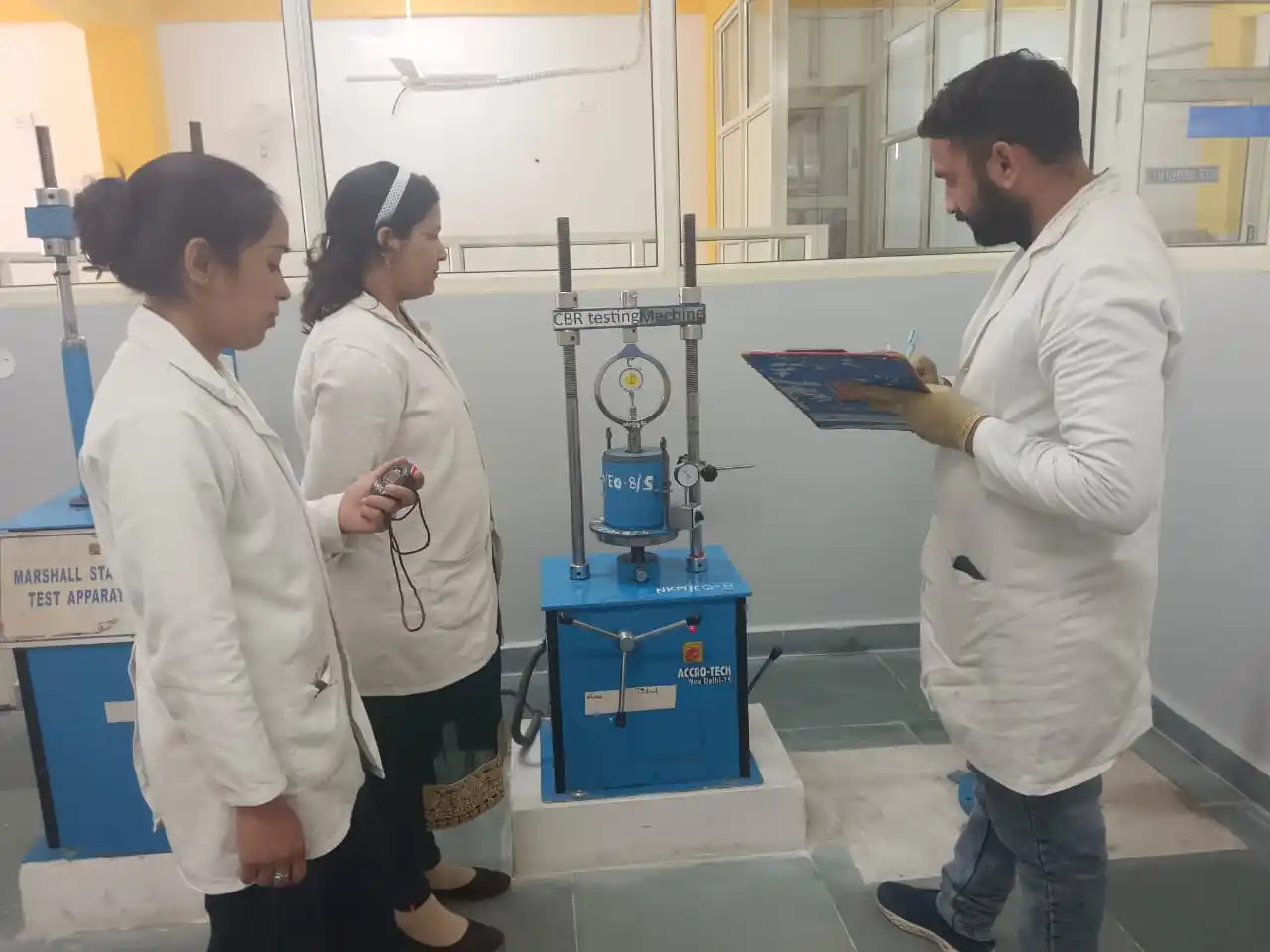 California Bearing Ratio (CBR) testing of soil using CBR testing machine for soaked and unsoaked conditions