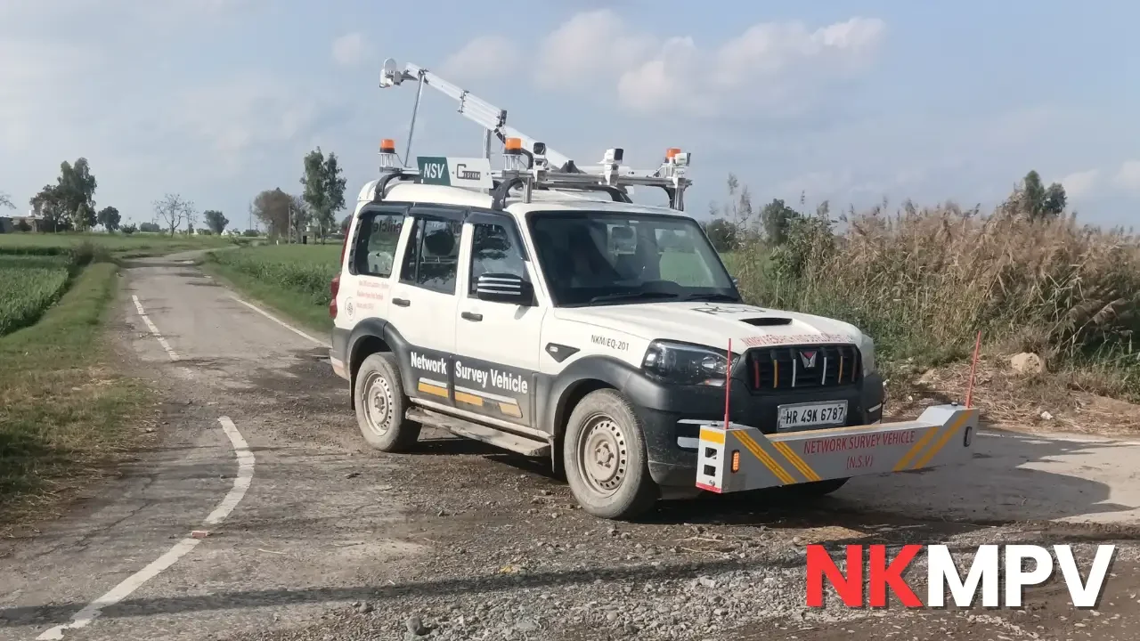 Network Survey Vehicle surveying damaged village road pavement